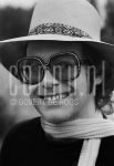 29-06-1976 Elton John in Amsterdam, The Netherlands. June 29, 1976.

[keywords]Headshot, Black & White Image, Sunglasses, Smiling, Hat, Scarf[/keywords]